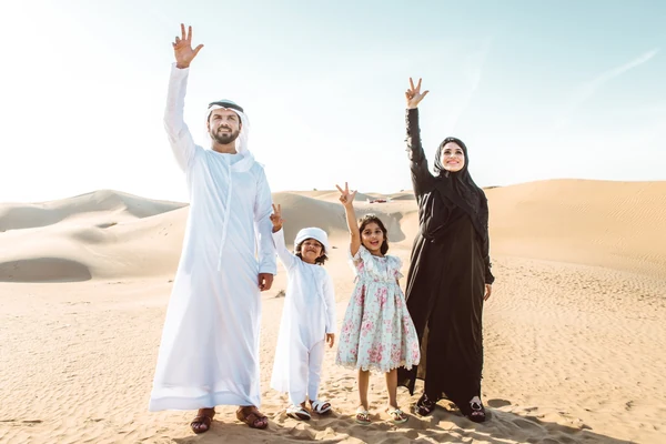 Family enjoying the Abu Dhabi desert dunes