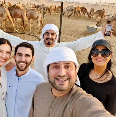 Sultan Karrani with Arabiers guests at a camel farm in Al Dhafra desert, Abu Dhabi