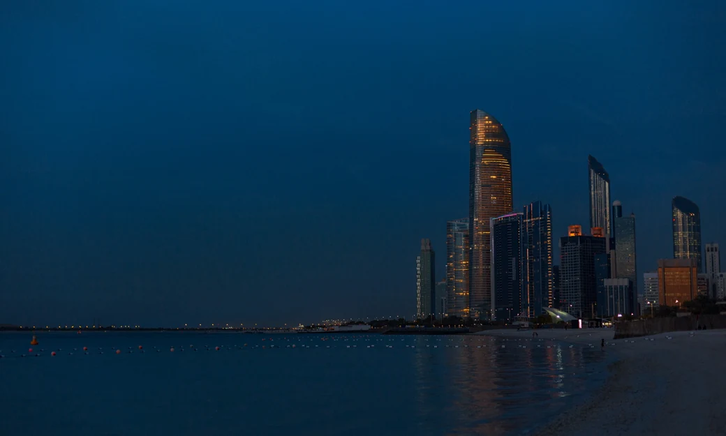Abu Dhabi Corniche beach and skyline in the evening