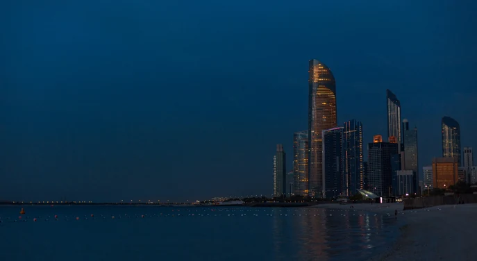 Abu Dhabi Corniche beach and skyline in the evening