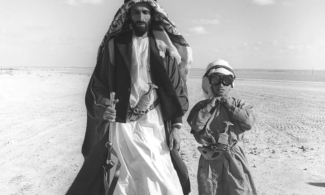 Emirati father and child in traditional dress