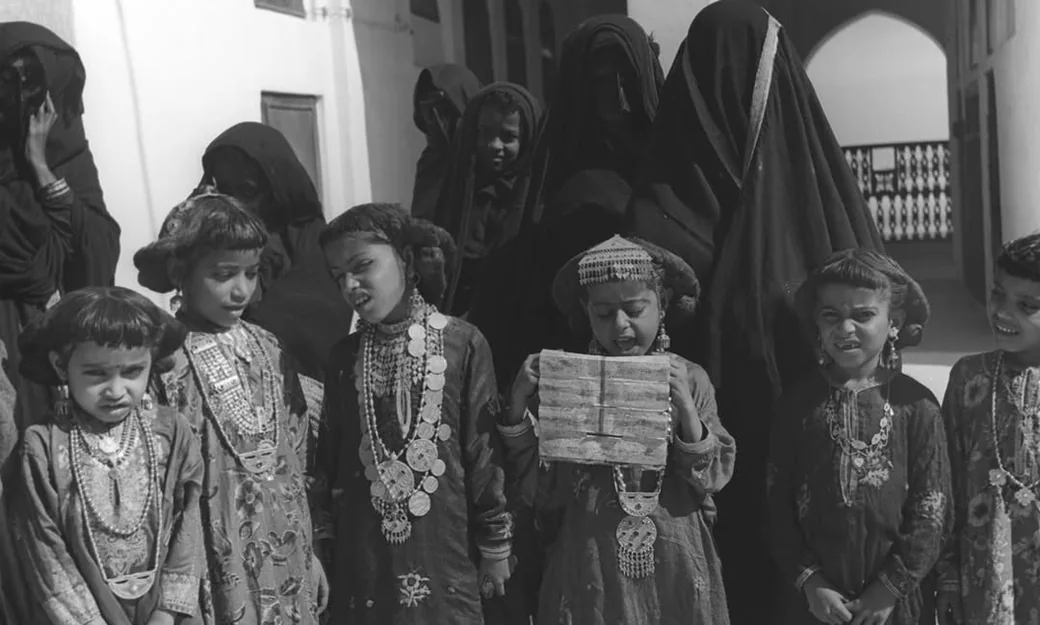 Emirati children in traditional clothing in historic Abu Dhabi