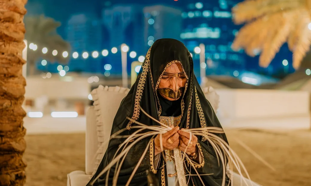 Emirati artisan weaving palm leaves