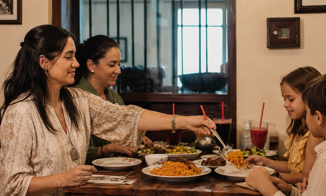 Family enjoying an Emirati meal at Al Fanar