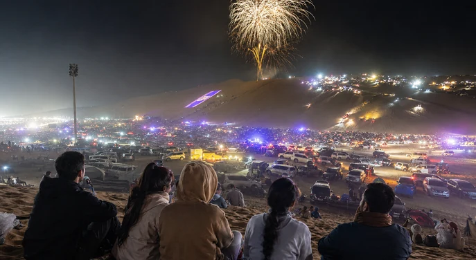 Fireworks lighting the night sky above the Liwa International Festival grounds