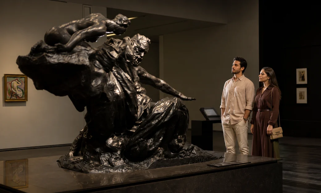 Couple viewing a monumental sculpture at Louvre Abu Dhabi