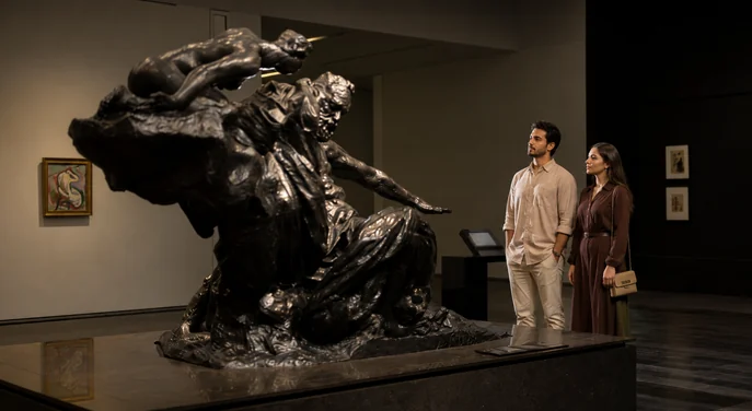 Couple viewing a monumental sculpture at Louvre Abu Dhabi