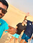 Arabiers guide taking a photo with morning desert safari guests in Abu Dhabi