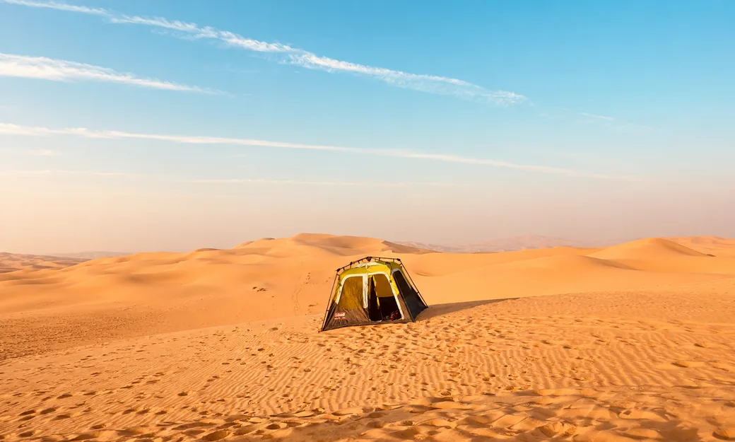 Private pop-up tent pitched among the Abu Dhabi desert dunes