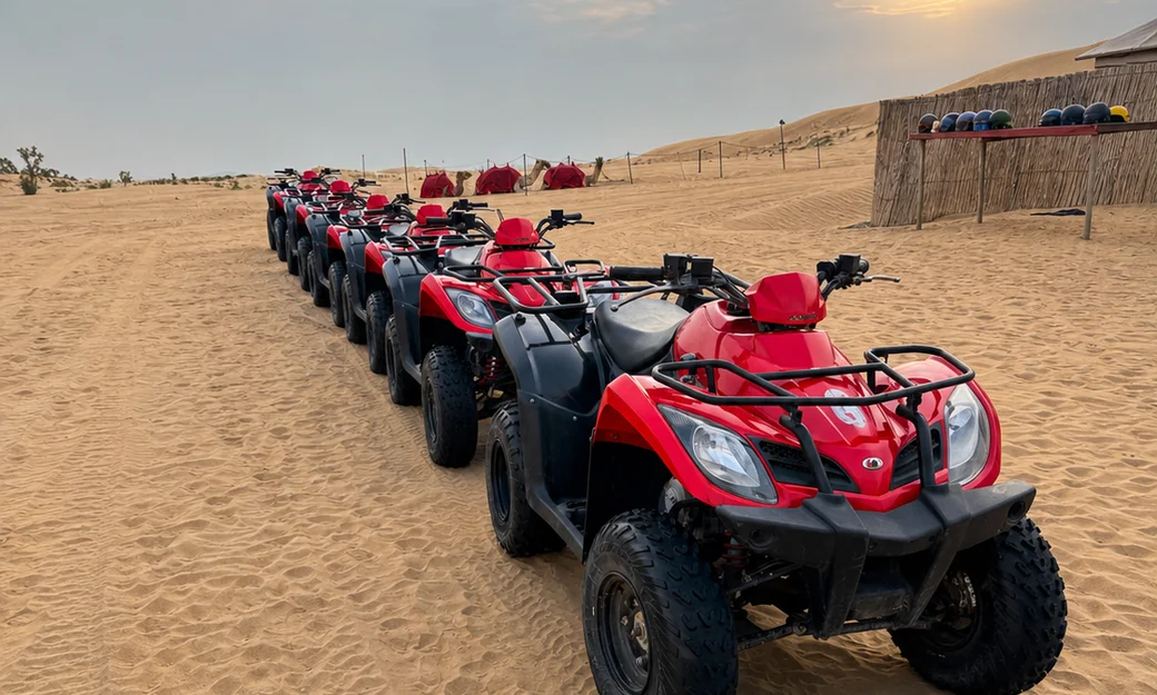 Row of quad bikes parked at a desert camp in Abu Dhabi