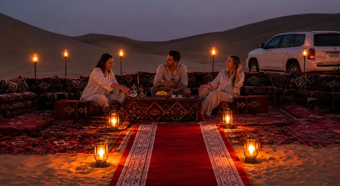 Guests relaxing at a torch-lit Royal Red Carpet Majlis in Abu Dhabi