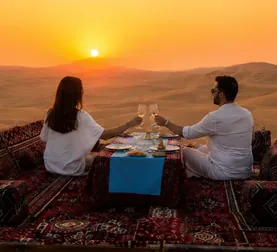 Couple dining privately at a Sunset Dune Majlis in Abu Dhabi