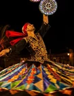 Tanoura performer during the Abu Dhabi desert camp evening show