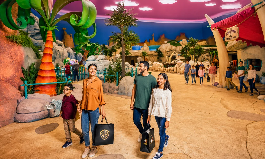 Family exploring the Flintstones themed zone at Warner Bros World Abu Dhabi