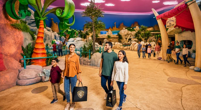 Family exploring the Flintstones themed zone at Warner Bros World Abu Dhabi