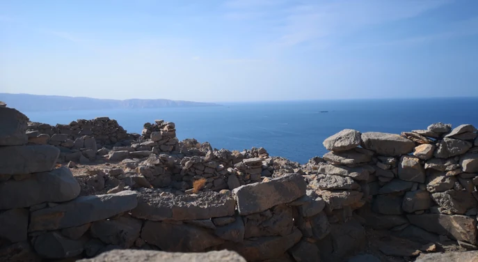 Old stone remains overlooking the Musandam coastline from Jebel Sham