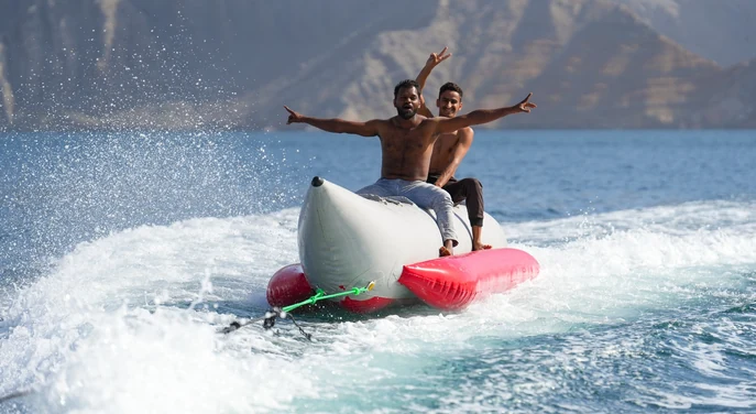 Guests enjoying a banana boat ride on the waters of Khasab