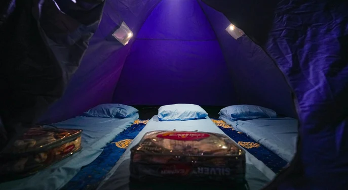 Prepared sleeping area inside a tent at a Musandam overnight beach camp