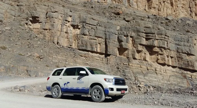 Four wheel drive vehicle at the rocky mountain trailhead in Musandam