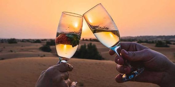 Champagne on top of a dune to Liwa Dune Sunset Champagne