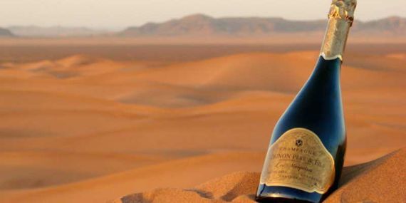 Champagne on top of a dune to Liwa Dune Sunset Champagne