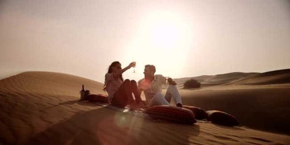 Champagne on top of a dune to Liwa Dune Sunset Champagne