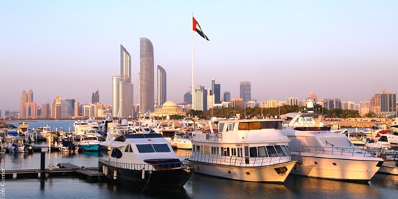 Abu Dhabi Marina yacht club with yachts docked near the Corniche