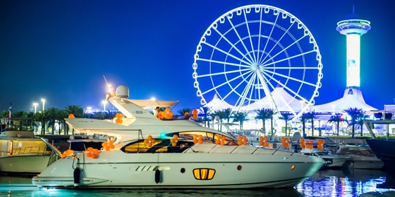 Azimut private yacht cruising in Abu Dhabi with skyline views