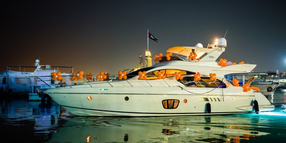 Azimut yacht cruising near Abu Dhabi skyline