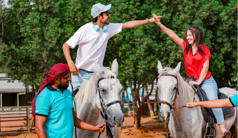Couple on a guided horseback desert experience with Arabiers in the UAE