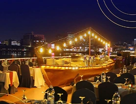 Dubai Creek Royal Dinner dhow cruise lit up at night