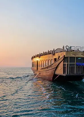 Sunset dhow cruise on calm Dubai water