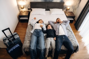 Family relaxing in a hotel room