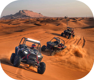 Two Can-Am dune buggies riding the Lahbab desert dunes near Dubai at sunset
