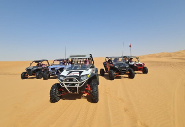 Dune buggies lined up for a morning ride in the Dubai desert