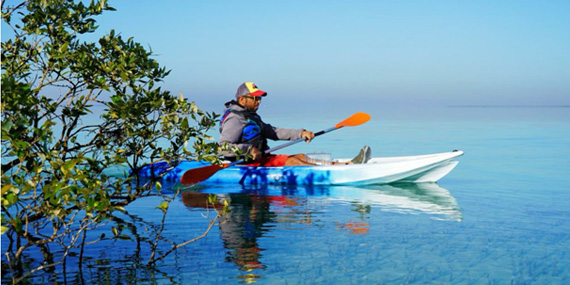 Single kayak on the calm water at Al Bahia Beach, Abu Dhabi