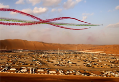 Cars and bikes at the Liwa Moreeb Dune Festival hill-climb