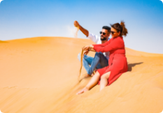 Sparkling toast at sunset on top of a Liwa sand dune