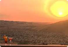 Sunset over the Liwa dunes during a Qasr Al Sarab cocktail tour