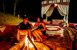 Private romantic desert dinner in a gazebo in Ras Al Khaimah at night