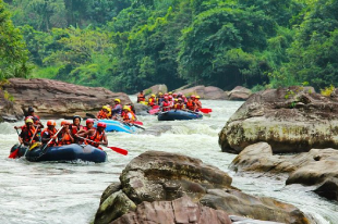 People white water rafting on a river in Sri Lanka